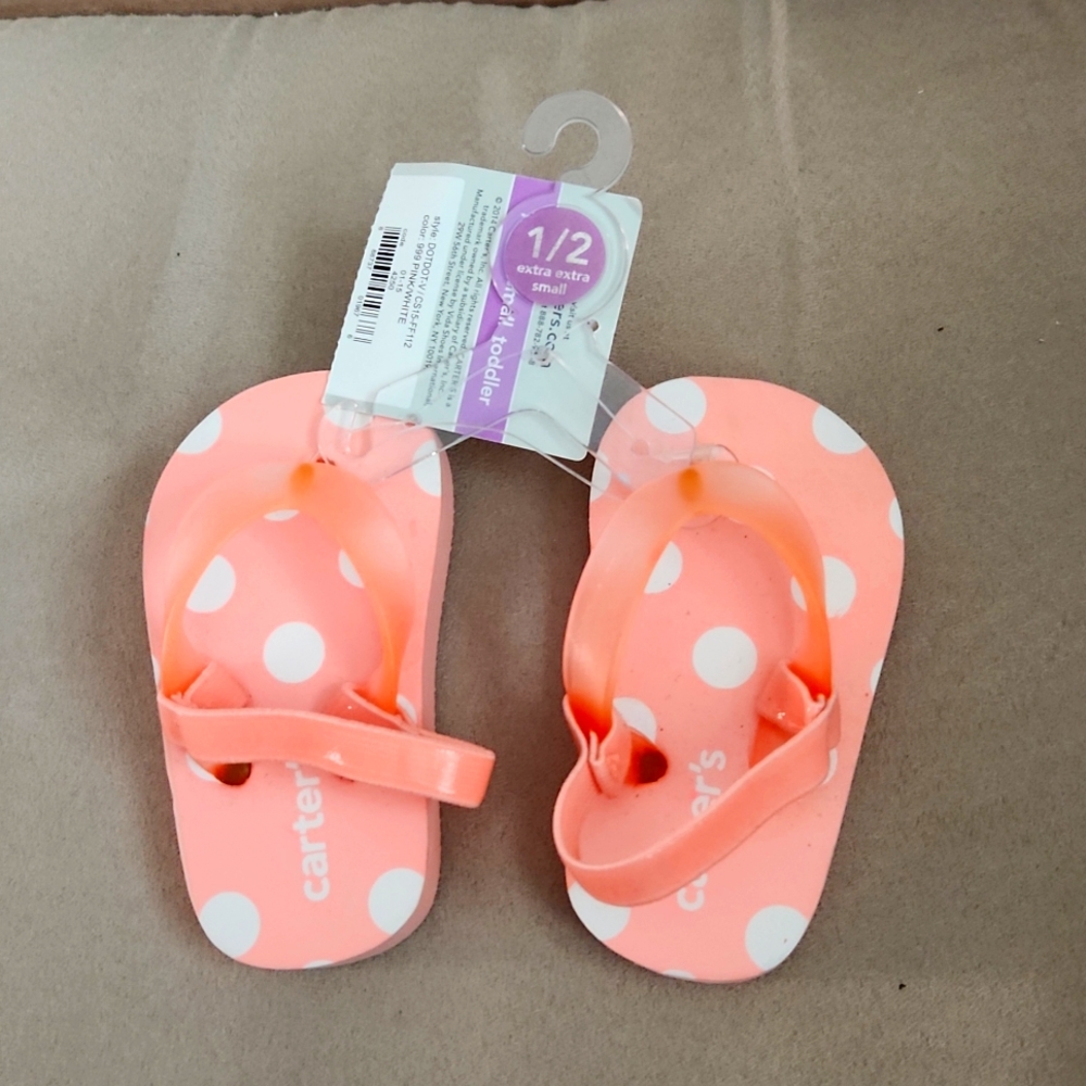 Carters baby poke dot flip flops very cute. With elastic band.